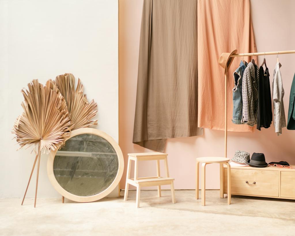 Clothes and Mirror Inside a Room with matching colours to create a capsule wardrobe
