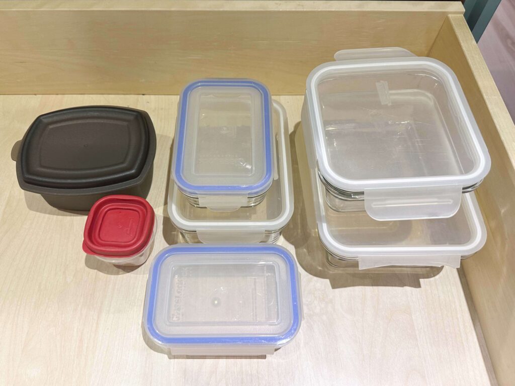 food storage containers with lids on in a drawer is great for kitchen organization