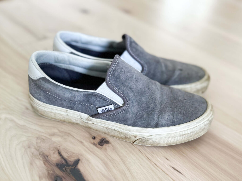 declutter and organize old small grey shoes
