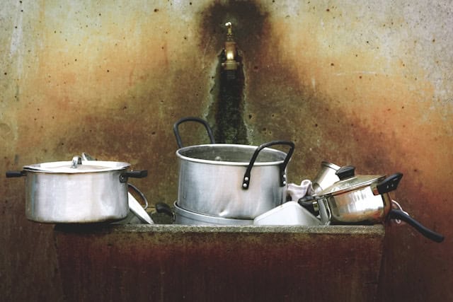 aluminum pans in a sink