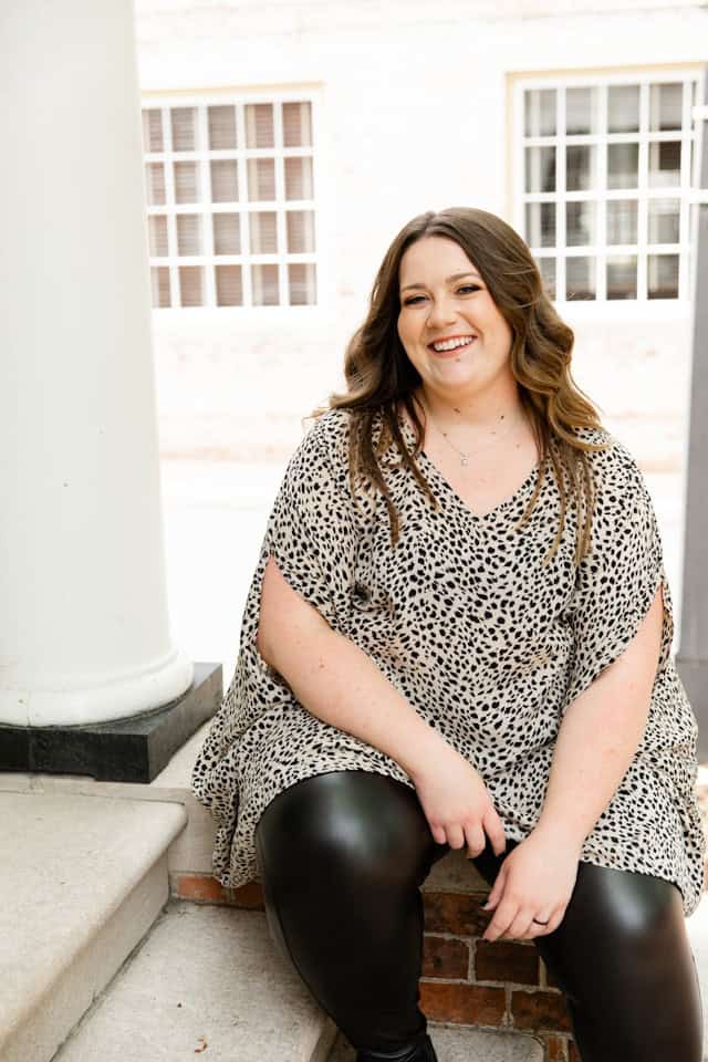 woman wearing leopard print top and faux leather pants