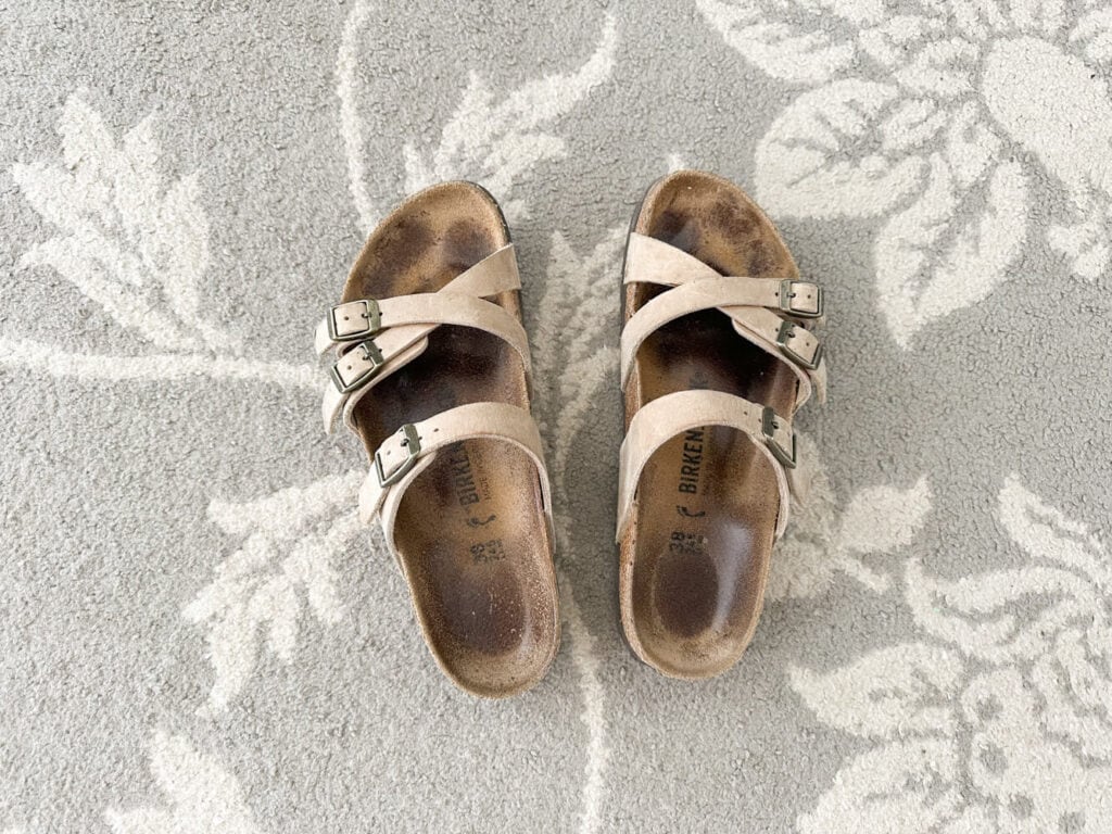 Birkenstock sandals on a rug