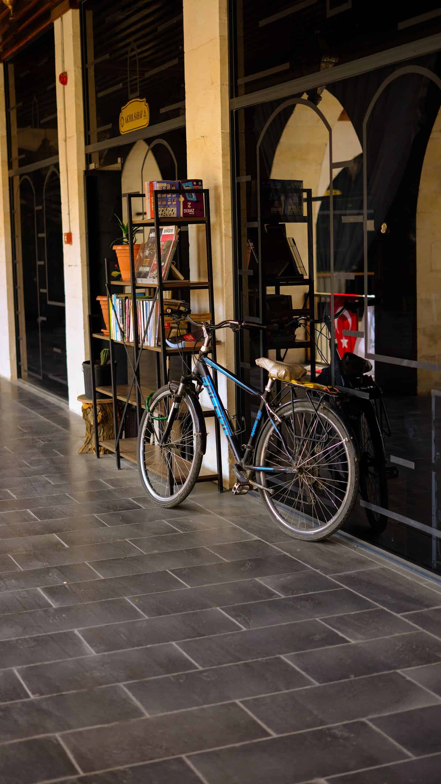 A bicycle parked outside a modern store in Gaziantep, Türkiye, showcasing local urban lifestyle.